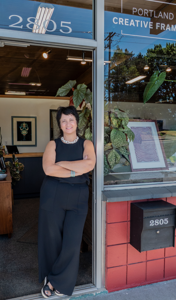 Jenna, owner of Portland Creative Framing, in her studio